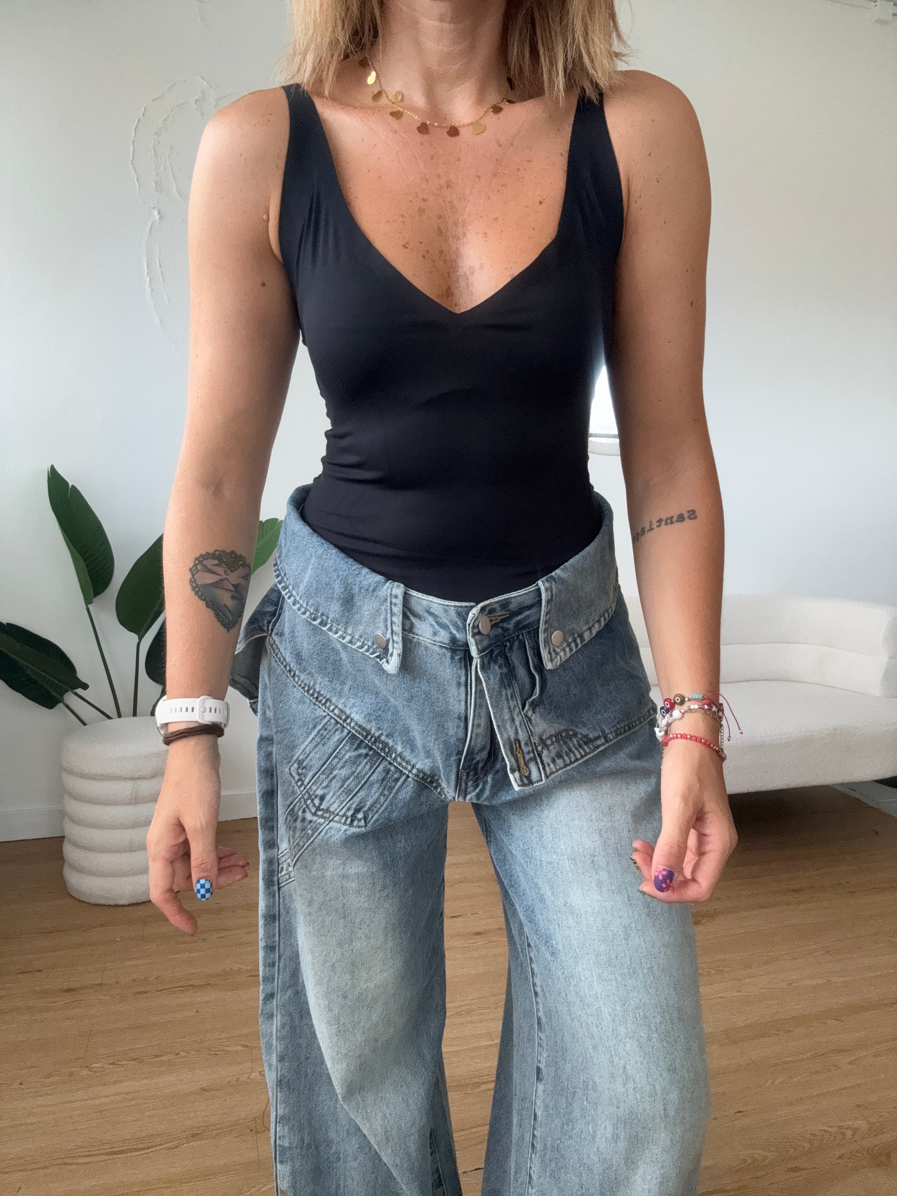 Jeans cintura effetto salopette