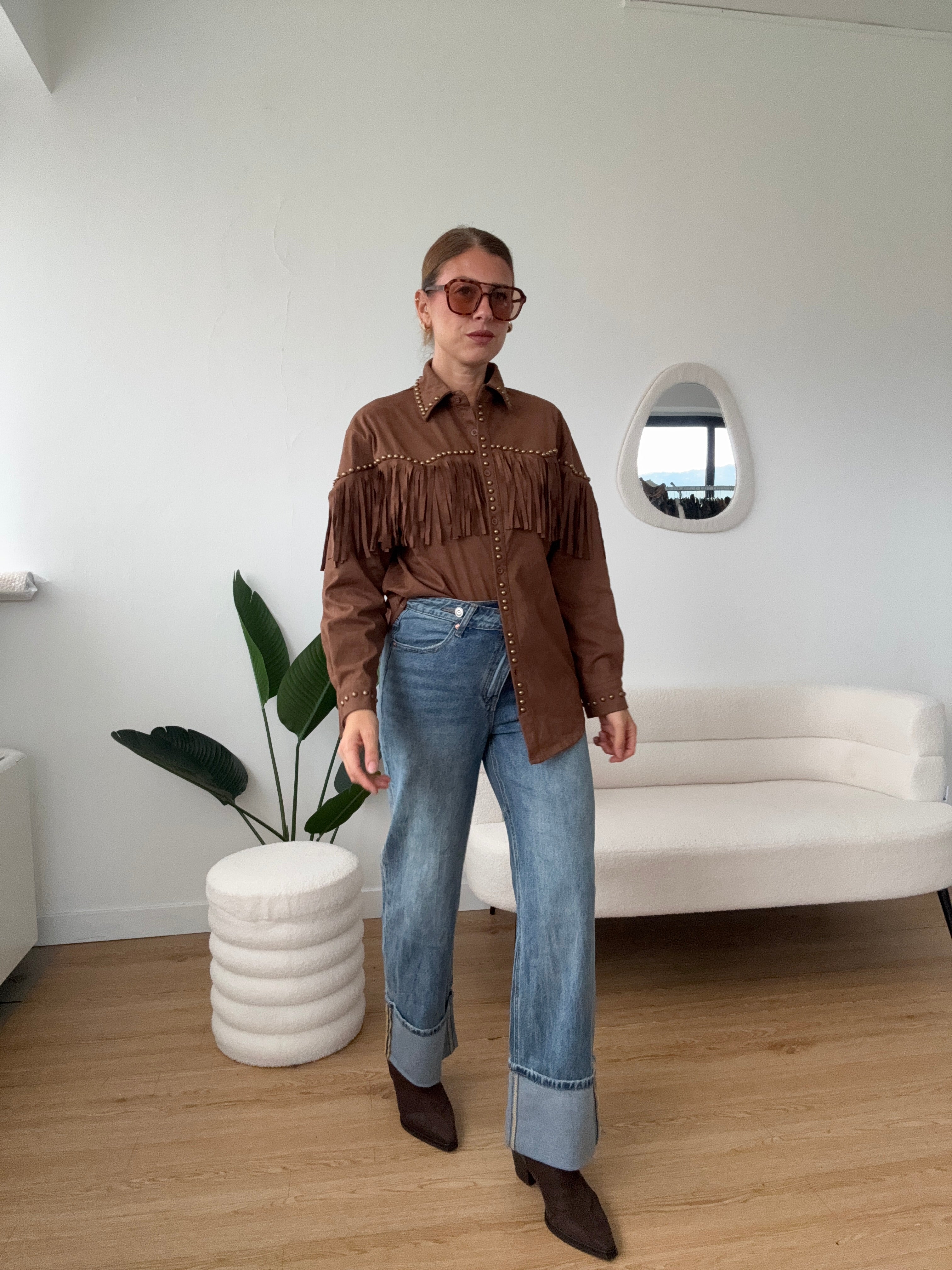 Jeans chiusura asimmetrica con maxi risvolto