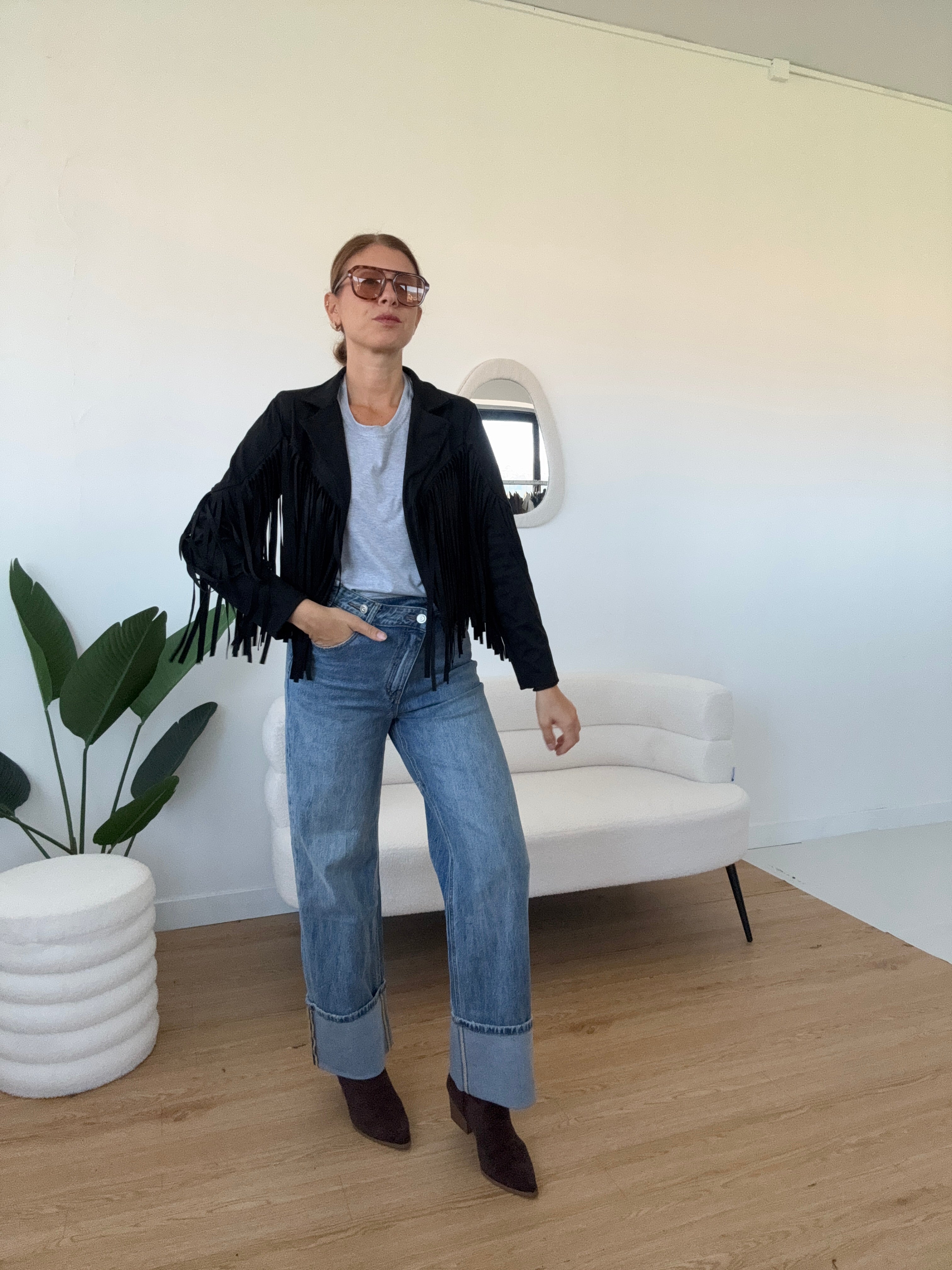 Jeans chiusura asimmetrica con maxi risvolto